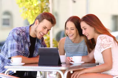 happy people looking at a computer